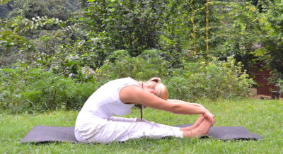 yoga poses - Liisa performing paschimottanasana
