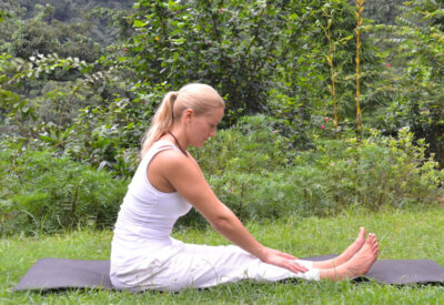 Yoga poses - Liisa demonstrating modified paschimottanasana
