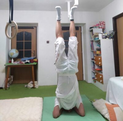 Jan practicing Sirsasana, the "headstand"